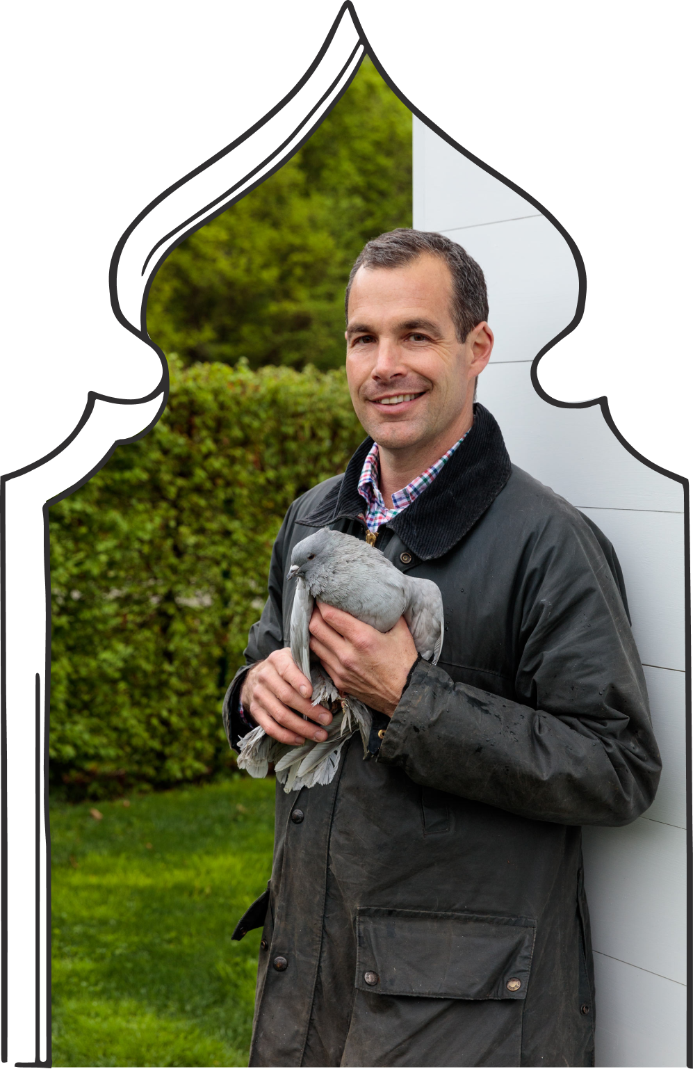 Christopher Spitzmiller holding a pigeon.
